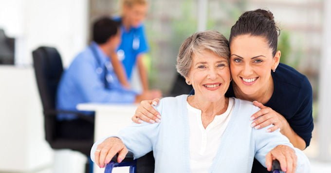 A CNA with an elderly patient